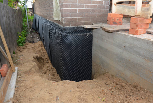 Happy homeowners after waterproofing job in Seymour